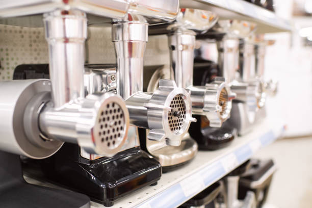 Meat grinders on a shelf in a store or showroom