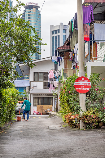 Kuala Lumpur, Malaysia - January 5th 2024:  Small street with laundry put out to dry in a residential quarter in the center of the Malaysian capital