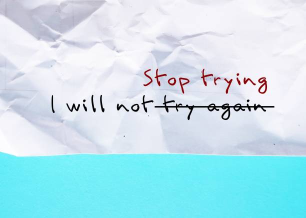 istock Crumpled paper on blue background with handwritten text I WILL NOT TRY AGAIN, changed to I WILL NOT STOP TRYING, to overcome negative self talk and replace with positive self talk affirmation 2096364511