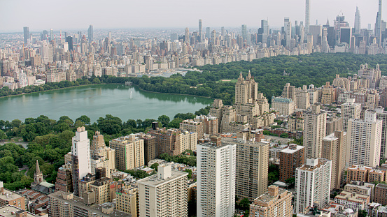 Aerial view of Central Park surrounded by skyscraper buildings in New York City, New York State, USA.