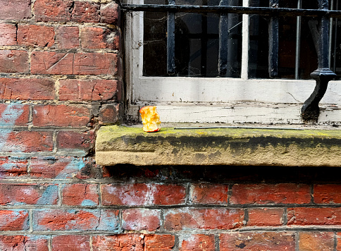 Old stone wall and window with an apple core