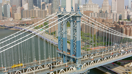 Aerial view of Manhattan Bridge over East River surrounded by skyscraper buildings, New York City, New York State, USA