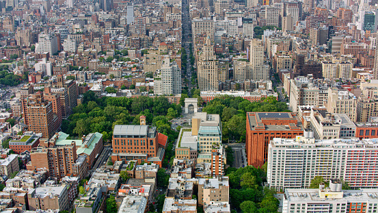 New York city skyline. Aerial view of NY Manhattan skyscrapers and Empire state building, blue sky with clouds background