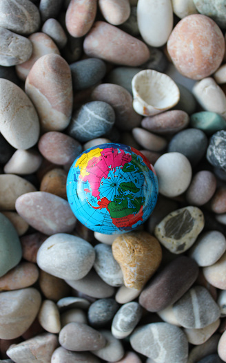 Miniature Globe With A Visible Image Of North Pole On Small Round Sea Rocks