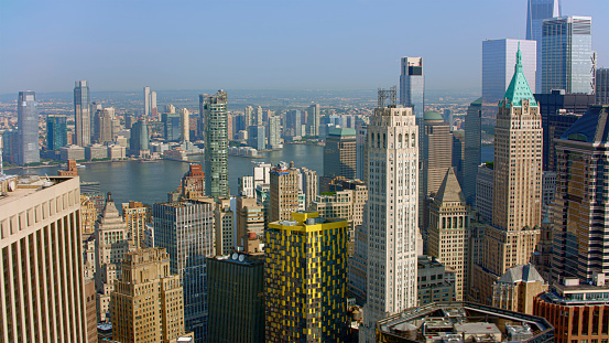 Aerial view of 20 Exchange Place and 40 Wall Street surrounded by modern skyscraper in New York City, New York State, USA.