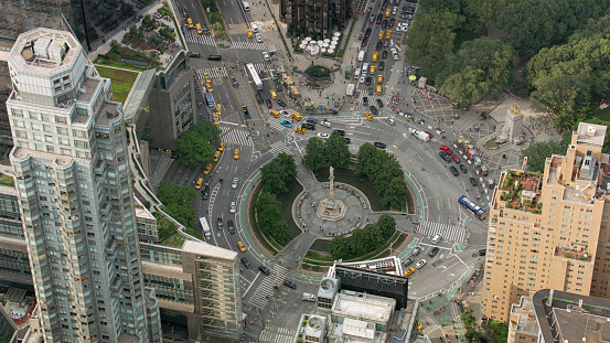 Aerial view of land Vehicles moving surrounded by Columbus Circle, New York City, New York State, USA.