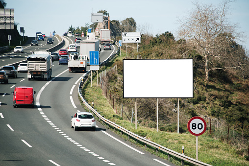 A blank billboard on a highway
