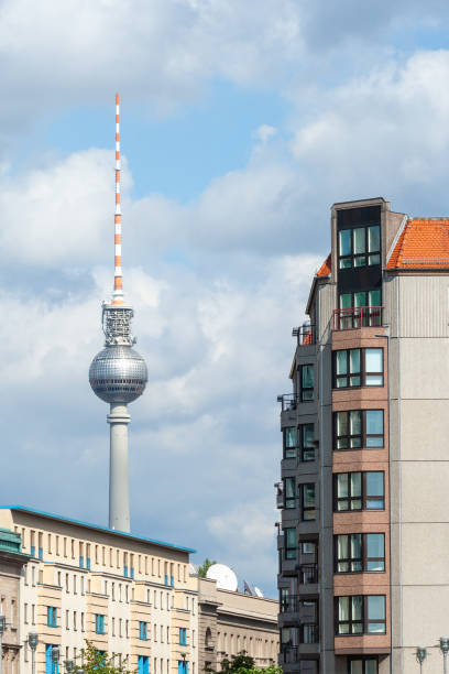 istock Berlin TV Tower next to buildings against the cloudy blue sky 2096414656