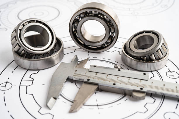istock Engineering tools and mechanical industrial with vernier caliper and metal ball bering. 2096415218