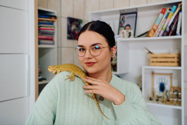 Beautiful Woman Posing with Her Adorable Bearded Dragon Pets