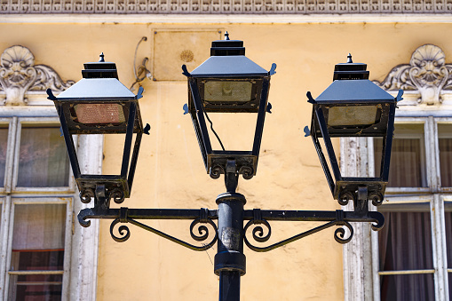 Old town of Slovenian City of Kranj with close-up of black a lantern on a sunny summer day. Photo taken August 10th, 2023, Kranj, Slovenia.