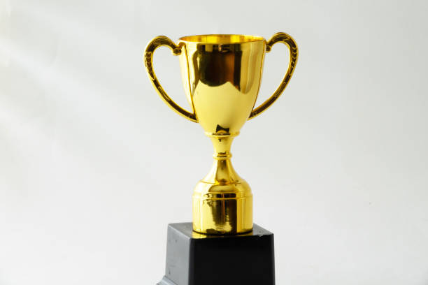 istock a gold trophy trophy on top of a black display stand 2096430593