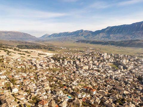 Aerial view over Gjirokaster in Albania, a town surrounded by mountains