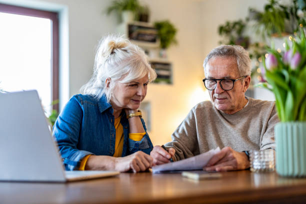 istock Senior couple sitting at the table discussing home finances 2096495192