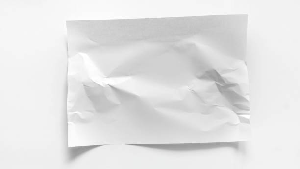 istock A white slightly crumpled A4 sheet lies on a white background. Mockup for inscriptions, words, advertisements with copy space. White crumpled sheet of paper close-up. 2096497968
