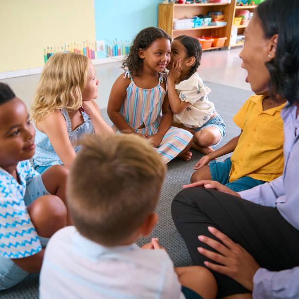 istock Multi-Cultural Primary Or Elementary School Class With Students Whispering To Each Other 2096508581
