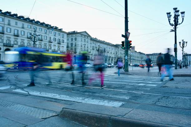 istock People crossing main street at blue hour 2096510397