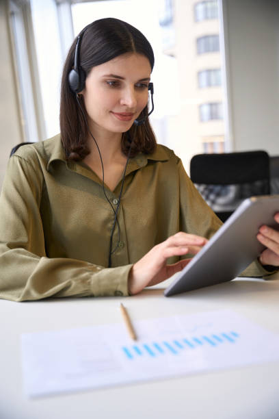 istock Smiling woman making e-commerce sales calls 2096513924