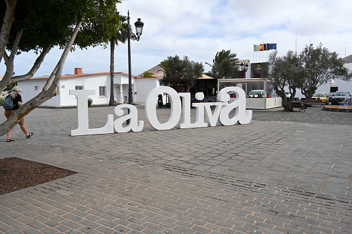 La Oliva, Fuerteventura, Spain, February 24, 2024 - Town sign in La Oliva on the square in front of the Church of Our Lady of La Candelaria, Fuerteventura.