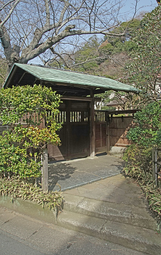 Photographed from the public road side of the Japanese-style entrance of a private house found in Kamakura, photographed data March 19, 2024, Kanagawa Prefecture, Kamakura City, Japan.