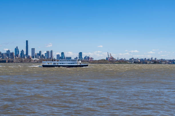 Brooklyn skyline behind Liberty ferry in Hudson River.