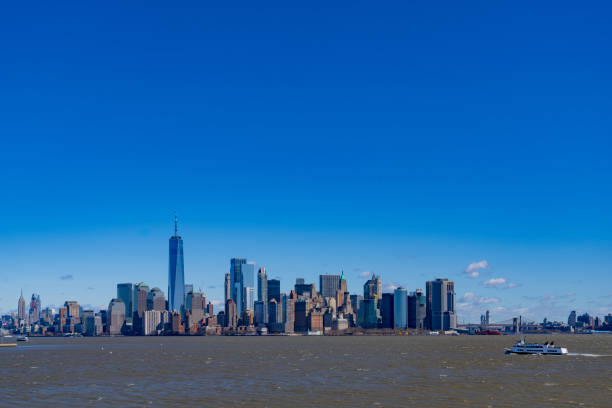 Manhattan skyline behind Liberty ferry in Hudson River.