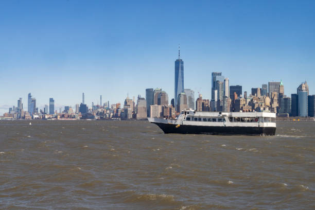 Manhattan skyline behind Liberty ferry in Hudson River.
