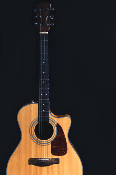 istock Acoustic guitar on a black background, flat lay. 2096605300