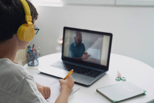 istock Studying from home. Teenager boy is Working on Homework for School. Education Concept 2096611095