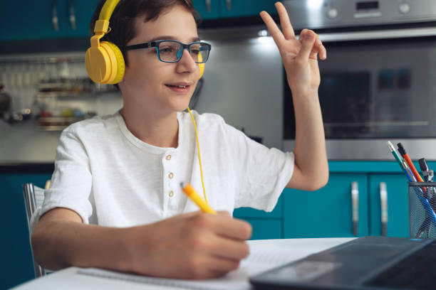 istock Studying from home. Teenager boy is Working on Homework for School. Education Concept 2096611108
