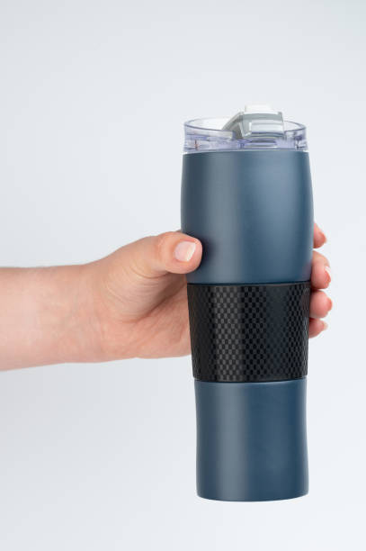 istock Blue metal flask in hand 2096619068