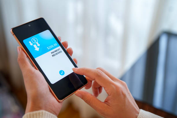 istock Cropped image of a woman's hand holds a smartphone displaying a message indicating 