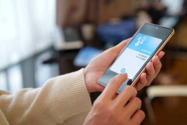 istock Cropped image of a woman's hand holds a smartphone displaying a message indicating 