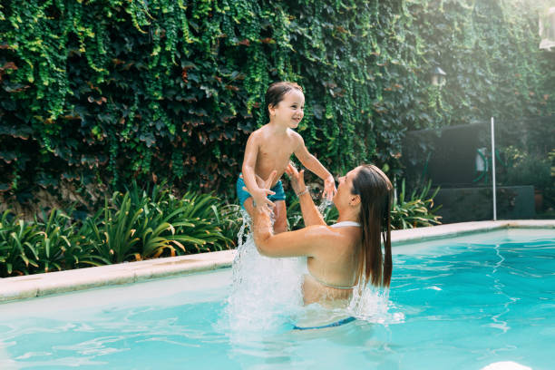 istock Mom an son into the water. 2096632535