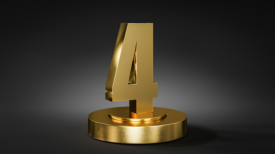 The number 4 on a pedestal / podium in golden color in front of dark background with spot light.