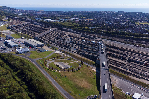 Aerial view of the Shuttle sidings where vehicles are loaded on to the trains. The channel tunnel is an undersea railway tunnel opened in 1994 linking England and France.