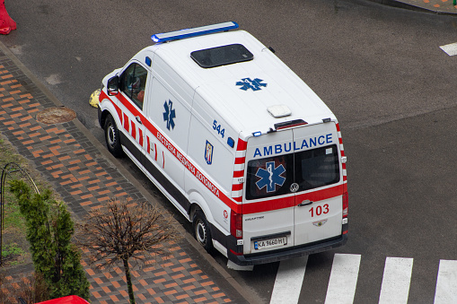 Emergency medical vehicle. 103 Ukrainian ambulance on the street. Ukraine, Kyiv - March 18, 2024.