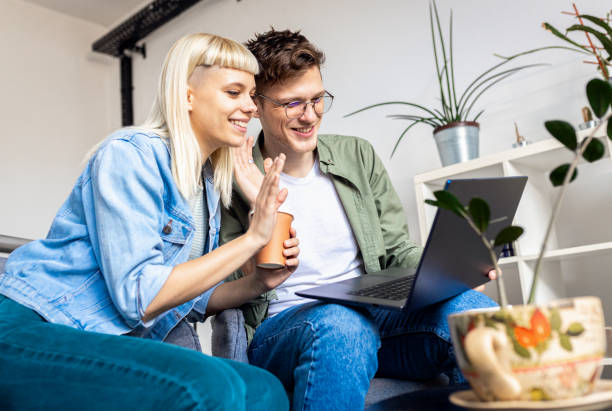 istock Two young business people working using laptop while sitting in modern office. 2096668658
