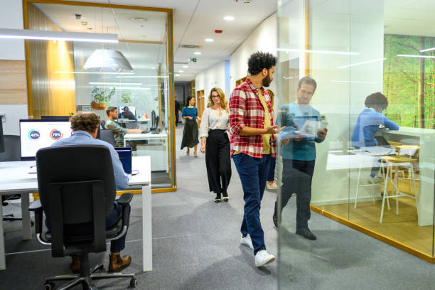 istock Business people walking in office 2096682577