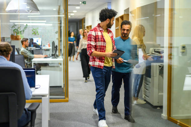 istock Business people walking in office 2096682593