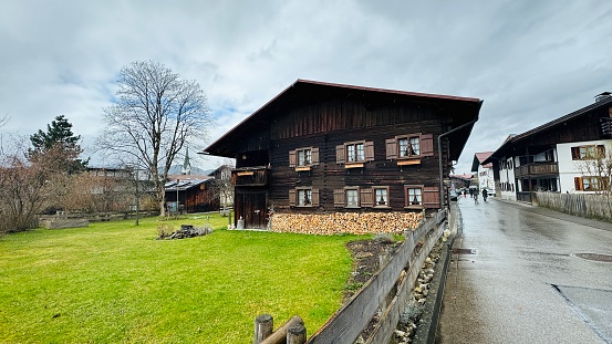 Oberstdorf, Germany - March, 12th - 2024: traditional wooden house in downtown.