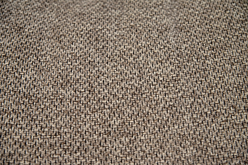 Brown woven matting fabric close up