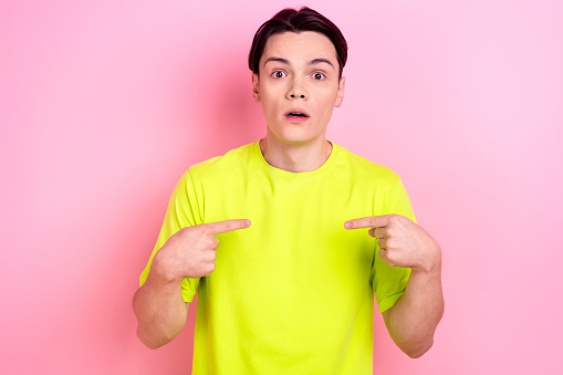 Photo portrait of nice teenager guy point self shocked offended accused dressed stylish yellow outfit isolated on pink color background.