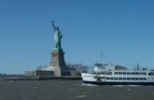 istock Brooklyn skyline behind Liberty ferry in Hudson River. 2096757795