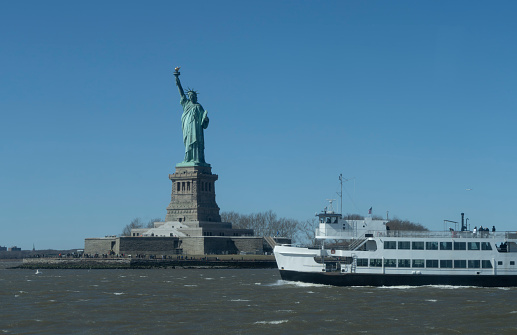 Brooklyn skyline behind Liberty ferry in Hudson River.