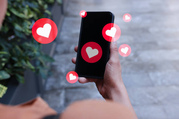 istock Women holding mobile phone with social media notification icon 2096774947