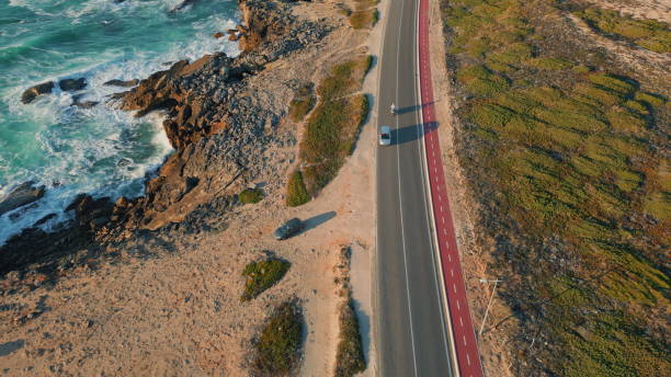 istock Highway running ocean coast summer day aerial view. Foamy ocean waves crashing 2096836861