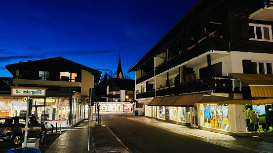 Oberstdorf, Germany - March, 14th - 2024: shopping street at night.