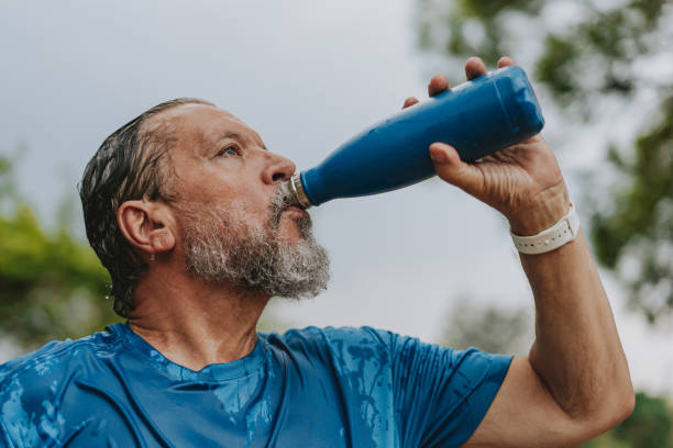 istock Portrait of a senior man drinking water exercising 2096877830