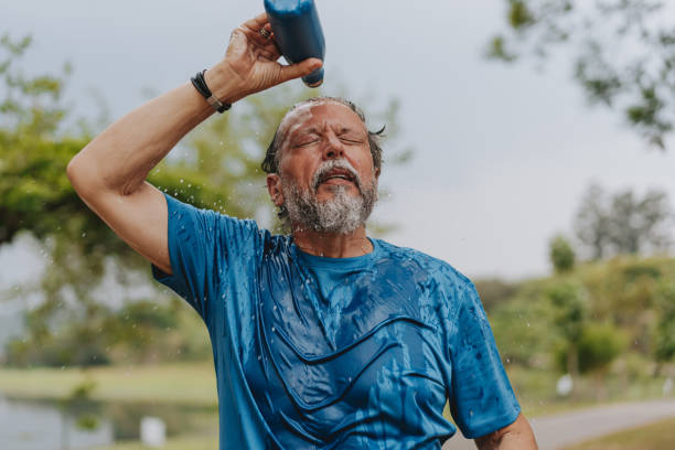istock Portrait of a senior man drinking water exercising 2096878129